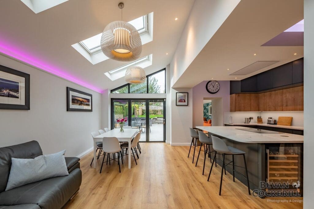 Kitchen Interior with skylight, island unit and bi-folding doors.