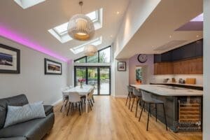 Kitchen Interior with skylight, island unit and bi-folding doors.